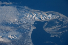 Last of the Bering Sea ice melting along this part of Russia’s coastline. (ESA / NASA)